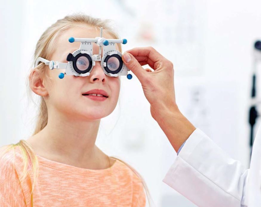 child getting eyes tested for myopia